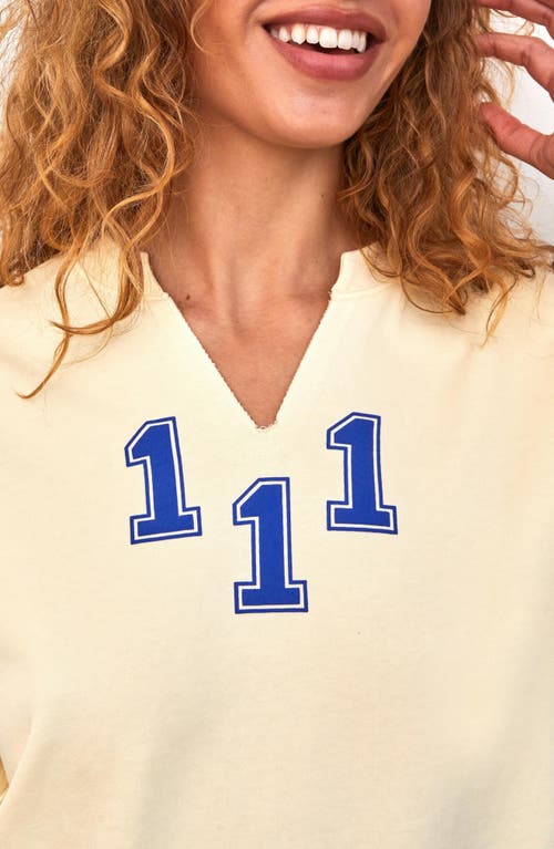 Shop The Mayfair Group Athletic Department Notch Neck Graphic Sweatshirt In Yellow
