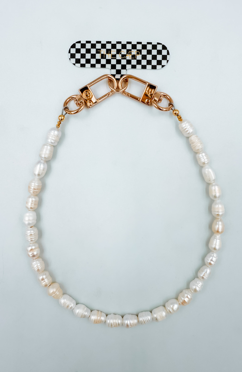 The Cæp Universal Wristlet In White