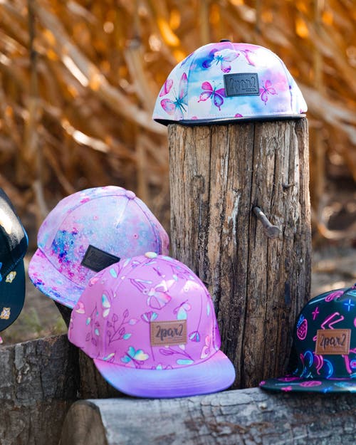 DEUX PAR DEUX DEUX PAR DEUX GIRL'S PRINTED CAP BUTTERFLIES ON MULTICOLORED AND BLACK BACKGROUND