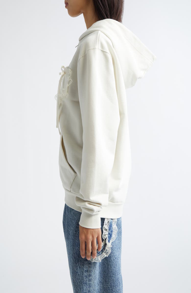 Tanner Fletcher Gender Inclusive Bennett Bow Pocket Cotton Zip-Up Hoodie, Alternate, color, Ivory