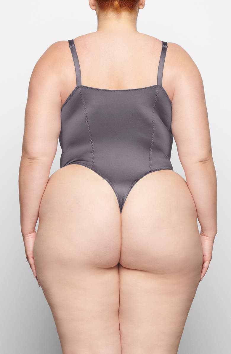 SKIMS Stretch Satin Underwire Thong Bodysuit, Alternate, color, Armor