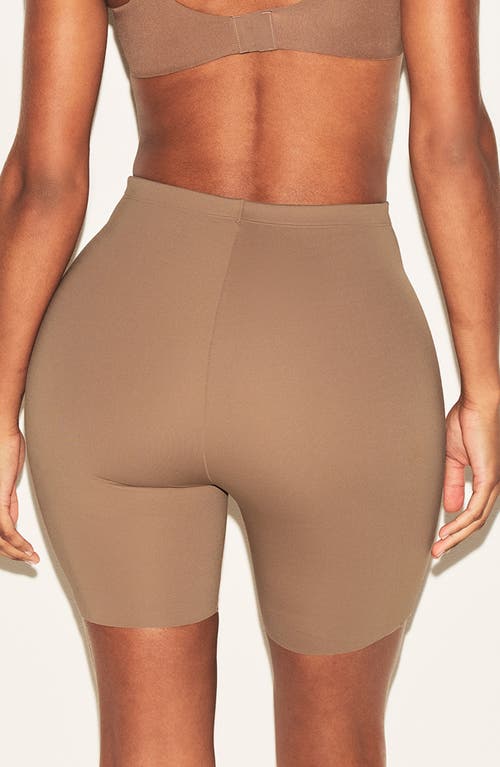 Skims Hip Enhancing Mid Thigh Padded Shorts In Brown