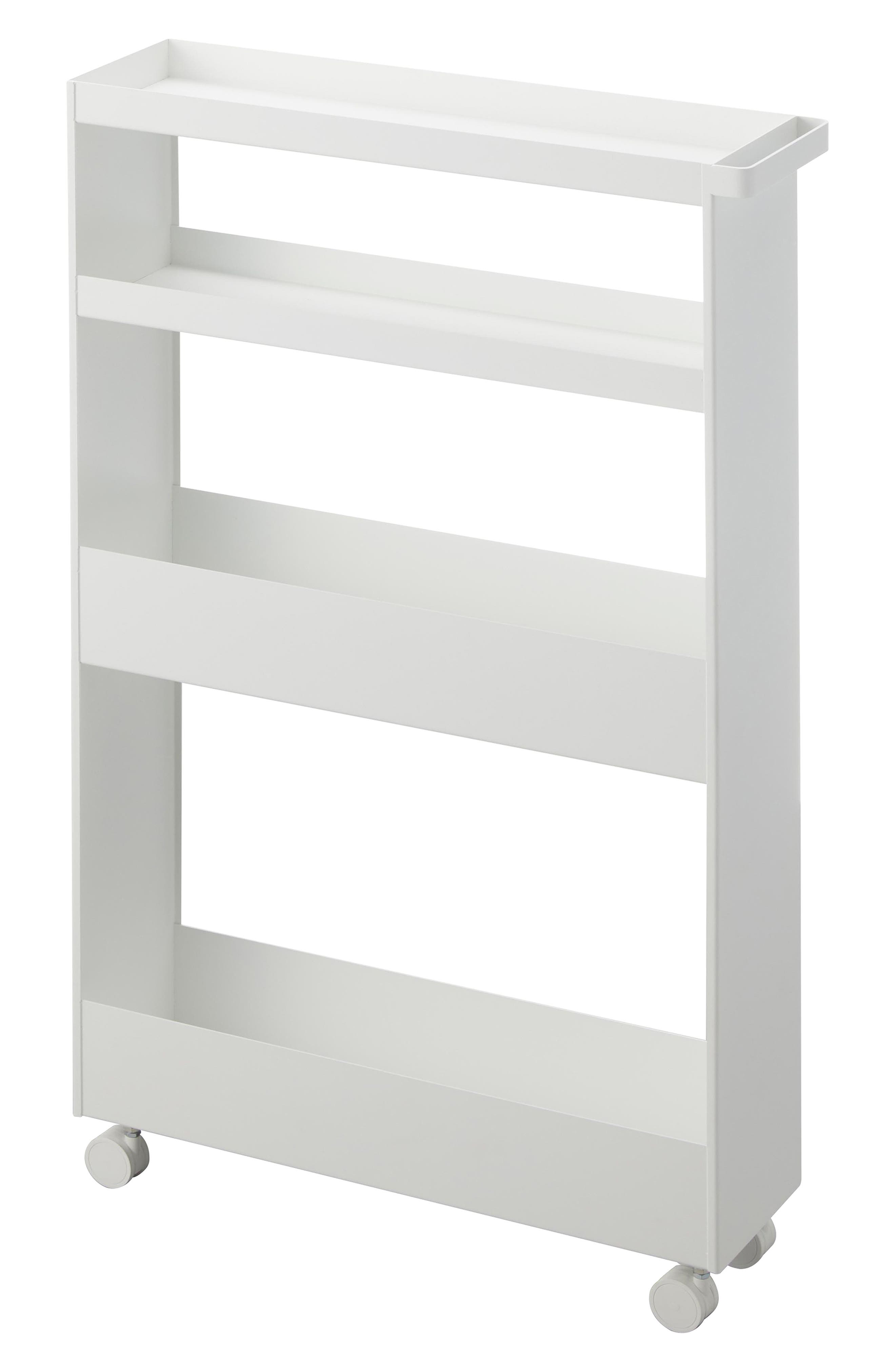 White shelving unit with three shelves and wheels