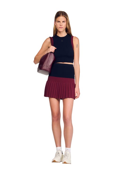 Short two-tone pleated skirt