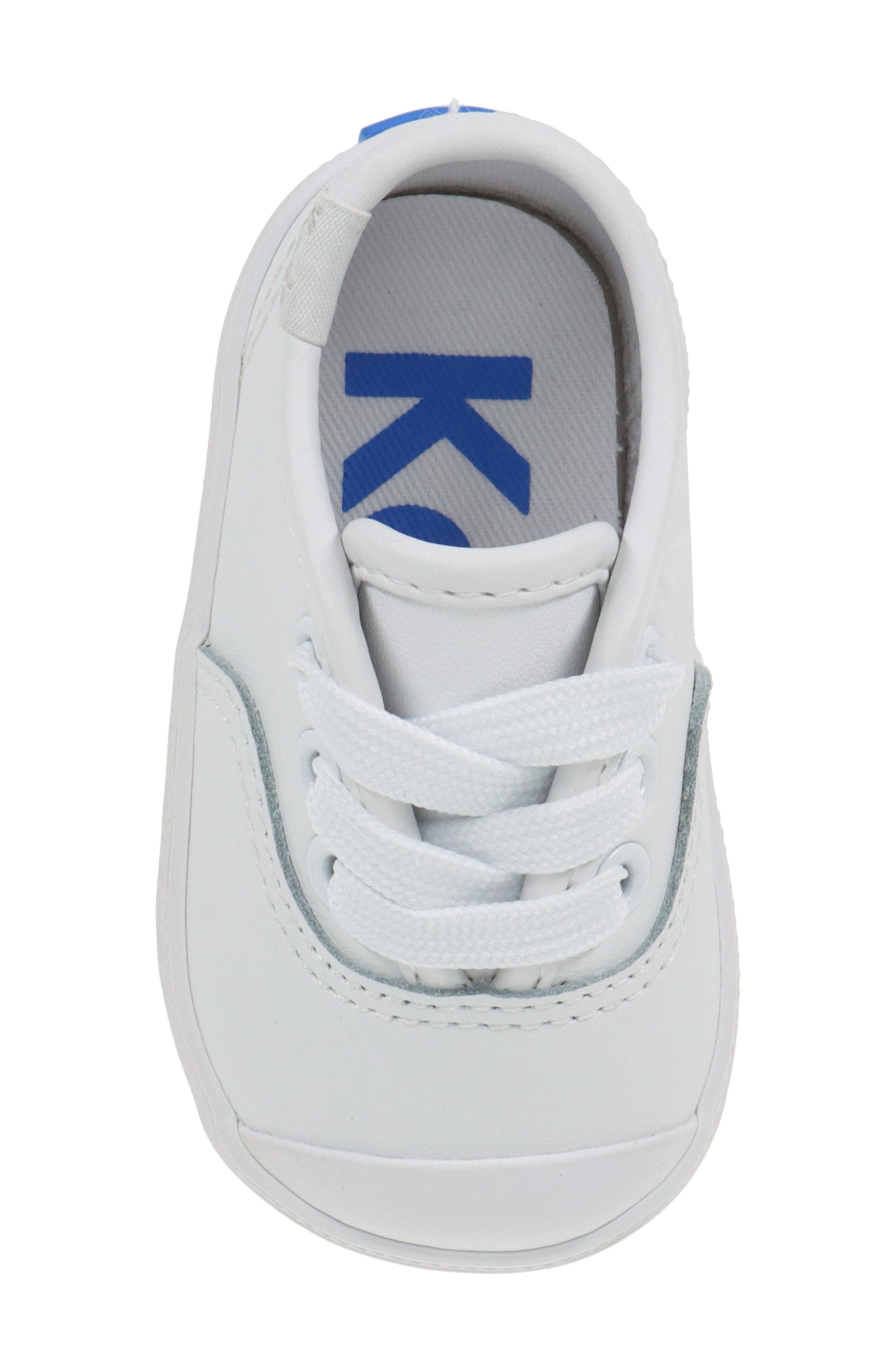 Keds<sup>®</sup> Kids' Champion Cap Toe Crib Shoe, Alternate, color, 