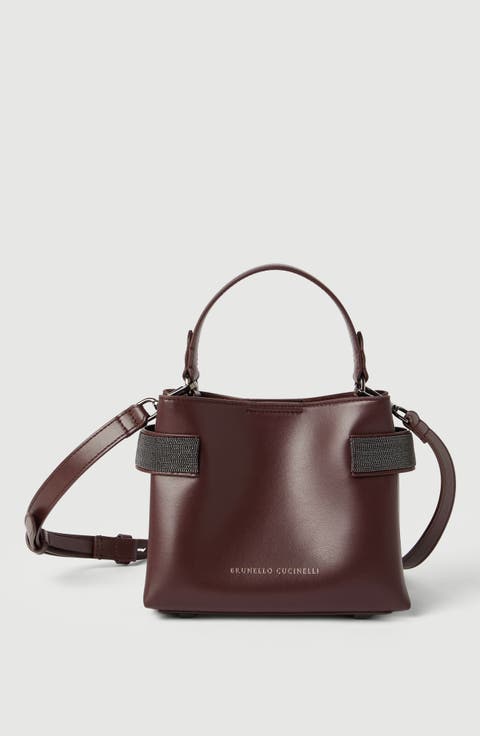 Essence small top-handle bag in calfskin with precious bands