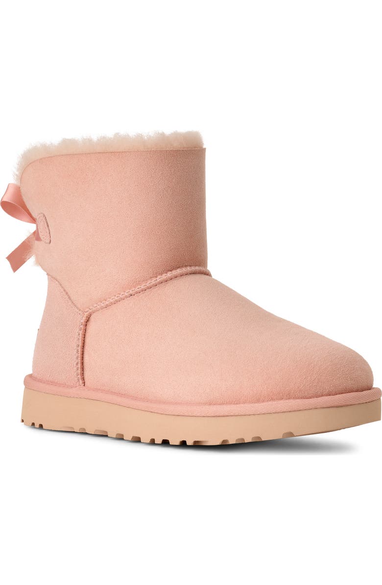 UGG<sup>®</sup> Mini Bailey Bow II Genuine Shearling Bootie, Main, color, Beige Blush