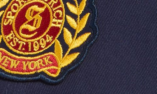 Sporty And Rich Sporty & Rich Logo Crest Embroidered Baseball Cap