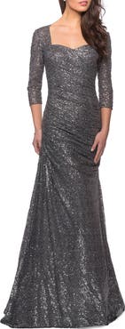 La Femme Floor Length Sequin Gown with Ruching and Sleeves