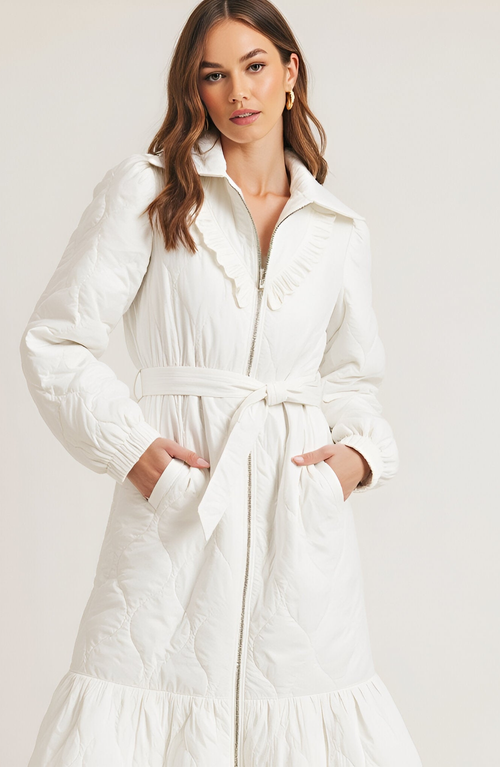 Modenaire Quilted Longline Coat With Ruffle Trim And Tie Waist Belt In White