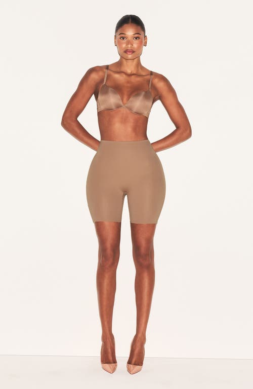 Skims Hip Enhancing Mid Thigh Padded Shorts In Brown