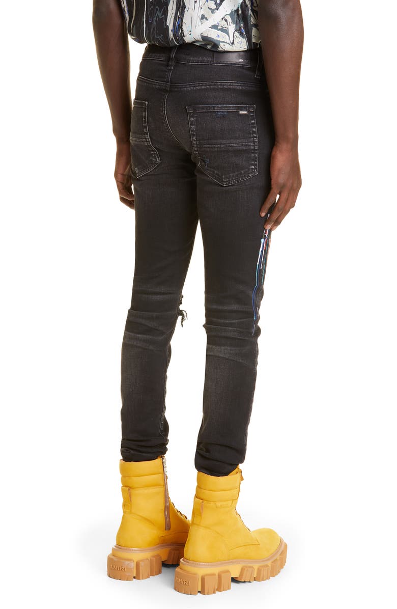 AMIRI Paint Drip Logo Ripped Skinny Jeans, Alternate, color, 