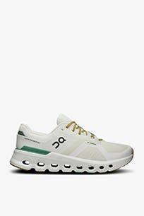 White running shoe with green accent.