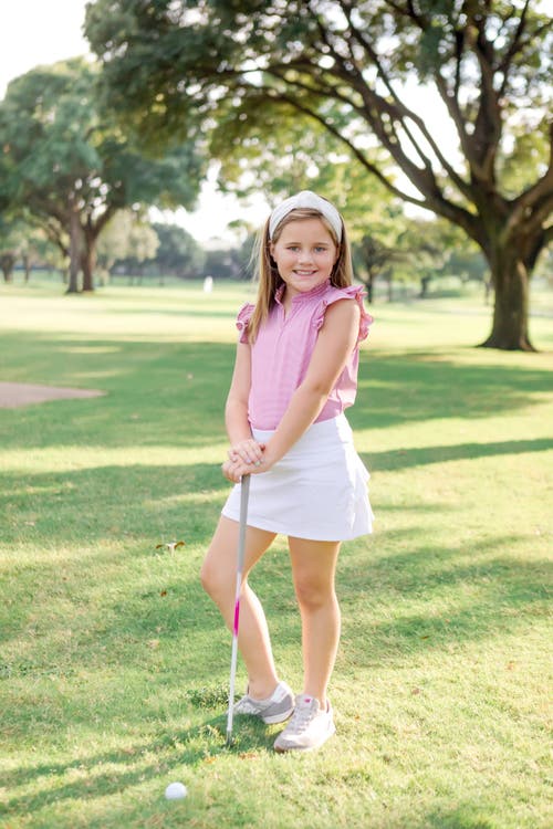 LILA AND HAYES LILA AND HAYES ELLIE GIRLS' SLEEVELESS RUFFLED TOP BY LH SPORT