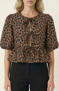 Modenaire Peplum Top With Front Tie Closures And Short Puff Sleeves