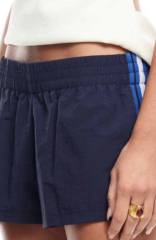 Shop Lioness Twilight Stripe Low Rise Nylon Shorts In Midnight