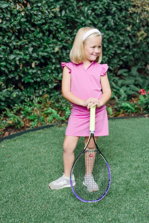 LILA AND HAYES LILA AND HAYES ELLIE GIRLS' SLEEVELESS RUFFLED TOP BY LH SPORT