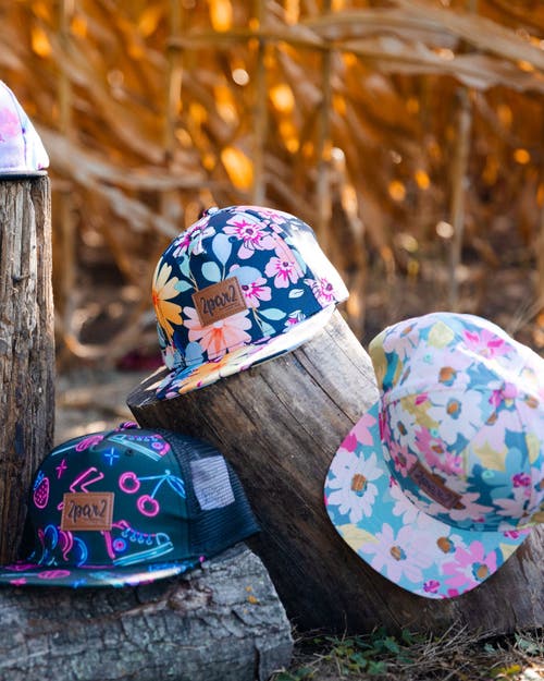 Deux Par Deux Baby Girl's Printed Cap White, Pink, And Green Flowers In White, Pink, And Green Flowers