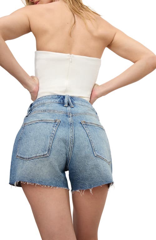 GOOD AMERICAN GOOD AMERICAN GOOD GIRLFRIEND RAW HEM CROSSOVER WAIST DENIM SHORTS