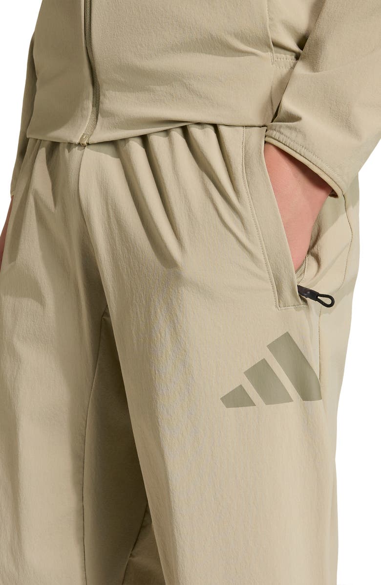 adidas Originals Kids' Z.N.E. Woven Travel Pants, Alternate, color, Wonder Cargo/ Clay