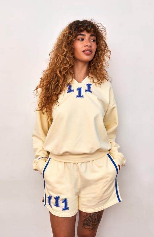 Shop The Mayfair Group Athletic Department Notch Neck Graphic Sweatshirt In Yellow
