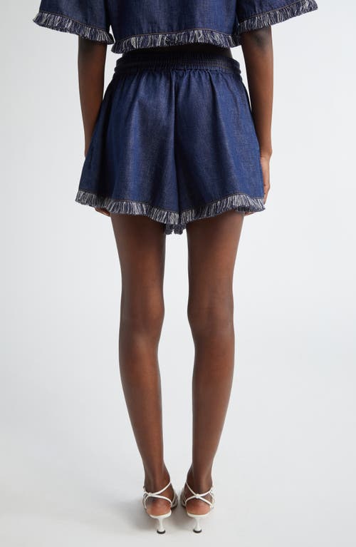 Shop Zimmermann Rhiannon Drawstring Waist Fringe Hem Denim Shorts In Atlantic