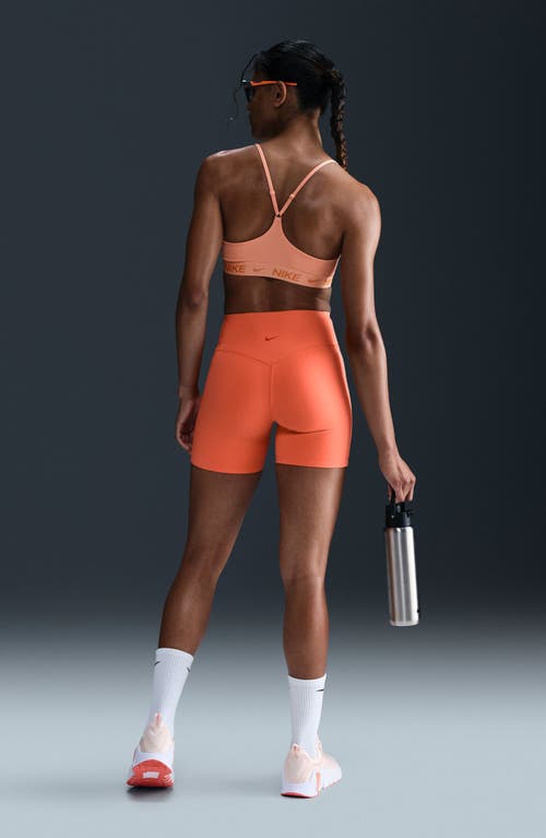 Nike Indy Light Support Padded Adjustable Sports Bra In Orange