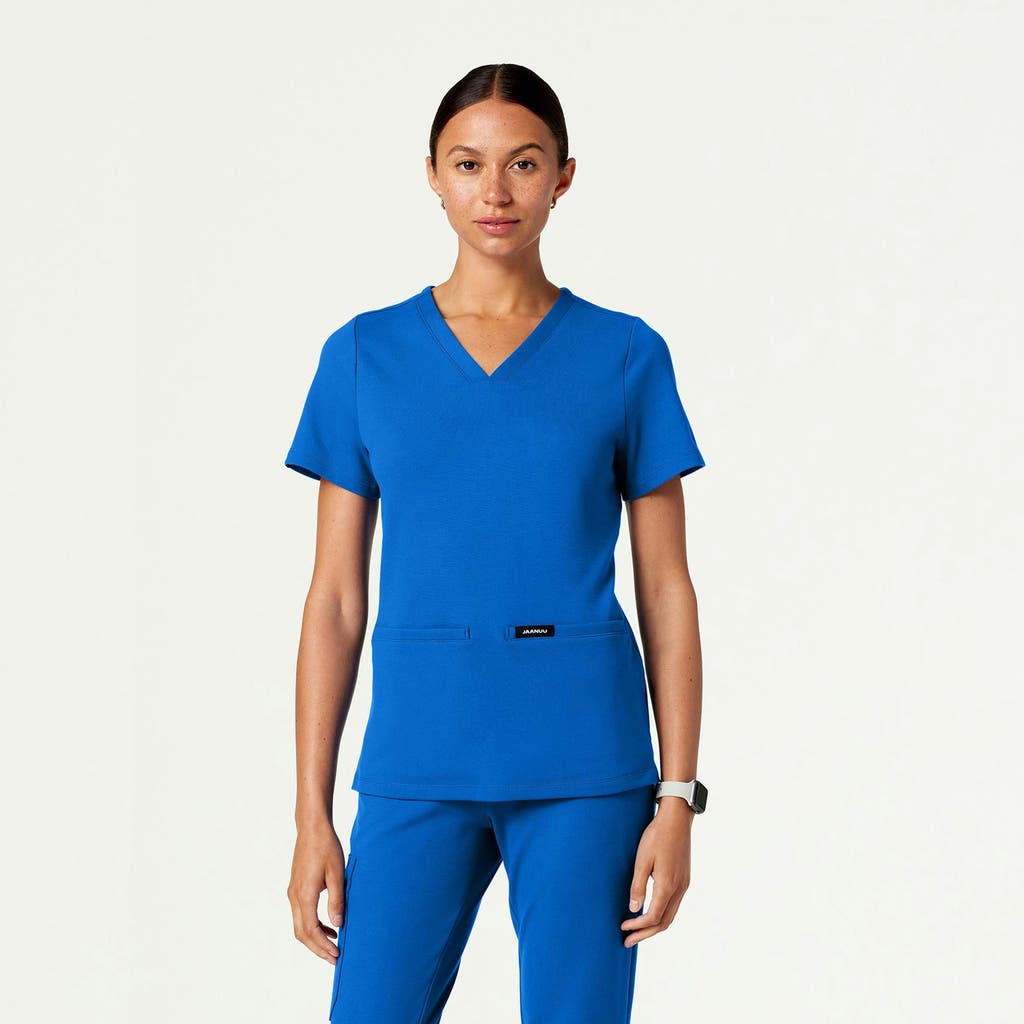 Jaanuu 2-pocket Slim Knit V-neck Scrub Top In Blue