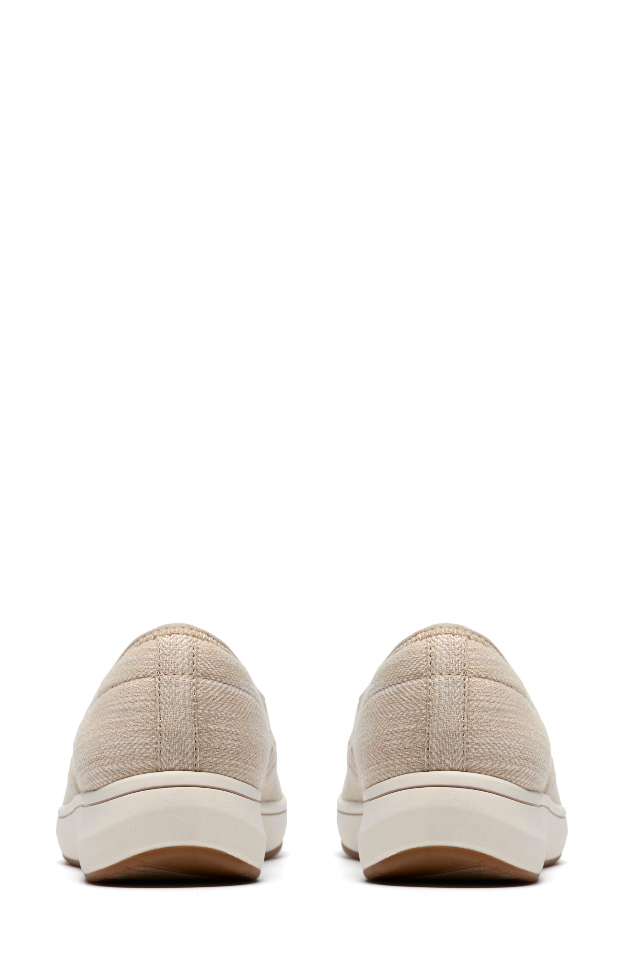 Clarks<sup>®</sup> BreezeSky Zoe Slip-On Sneaker, Alternate, color, Sand Canvas