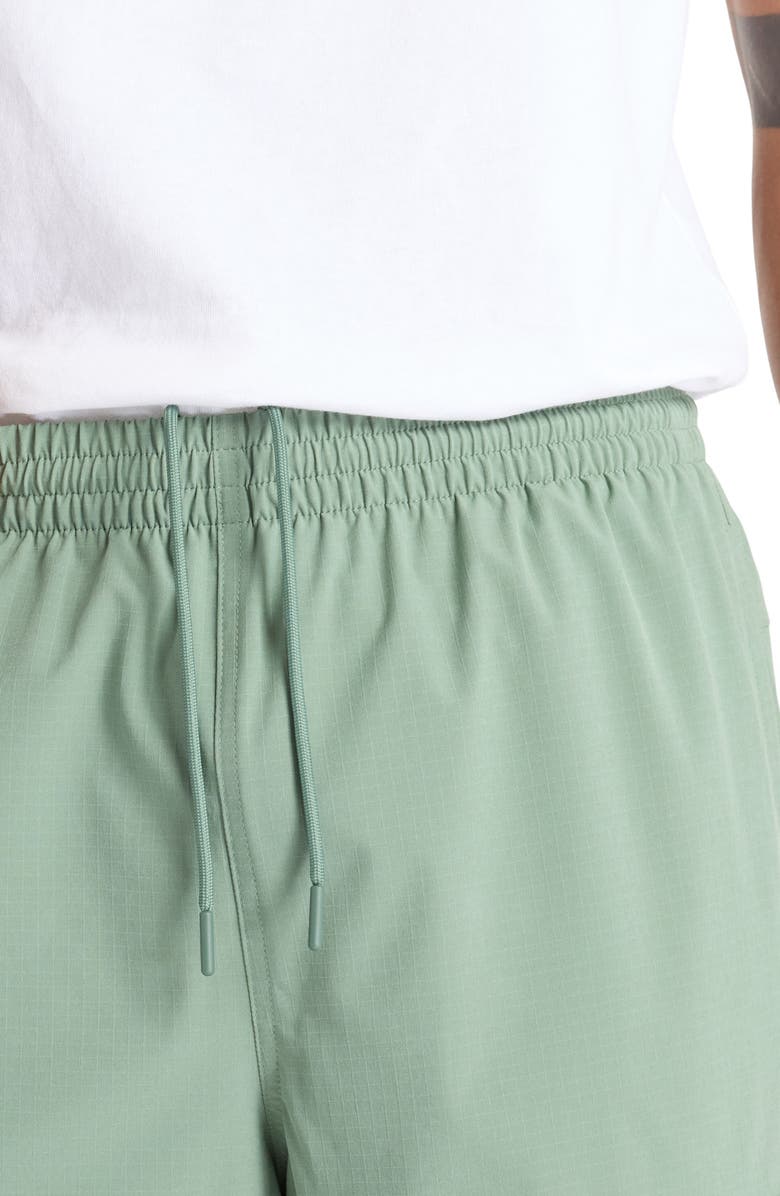 New Balance Water Resistant Stretch Ripstop Cargo Pants, Alternate, color, Dark Juniper