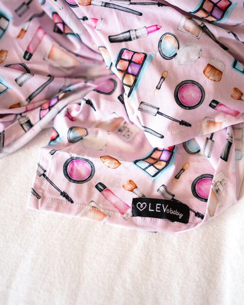 Lev Baby Makeup Print Soft Baby Swaddle Blanket In Pink