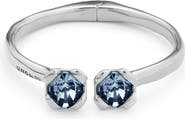 UNODE50 Sterling silver-plated bangle bracelet with inner spring and two blue crystals