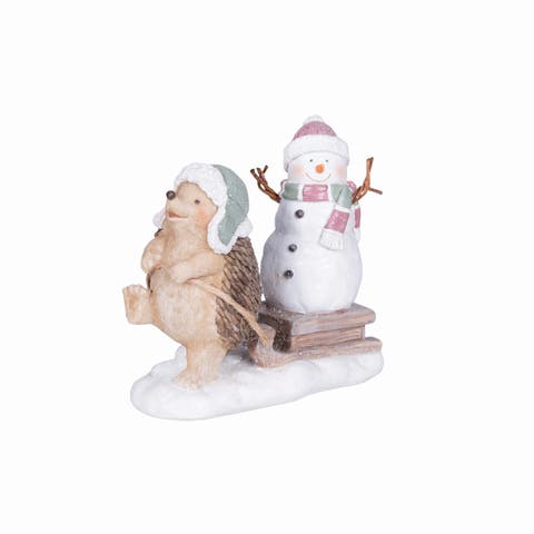 Hedgehog Pulling A Snowman Figurine