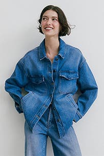 A woman wearing a denim button-up shirt.  