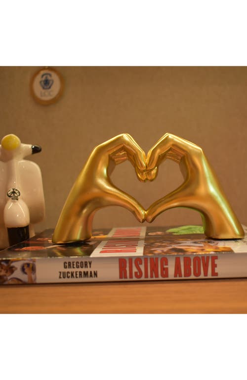 Shop Kinetic Heart Sign Hands Sculpture In Gold