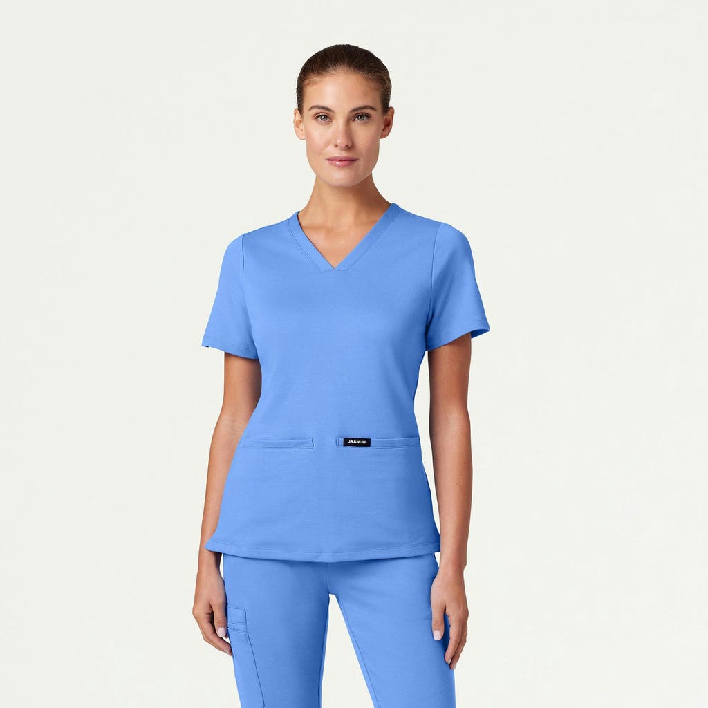 Jaanuu 2-pocket Slim Knit V-neck Scrub Top In Blue