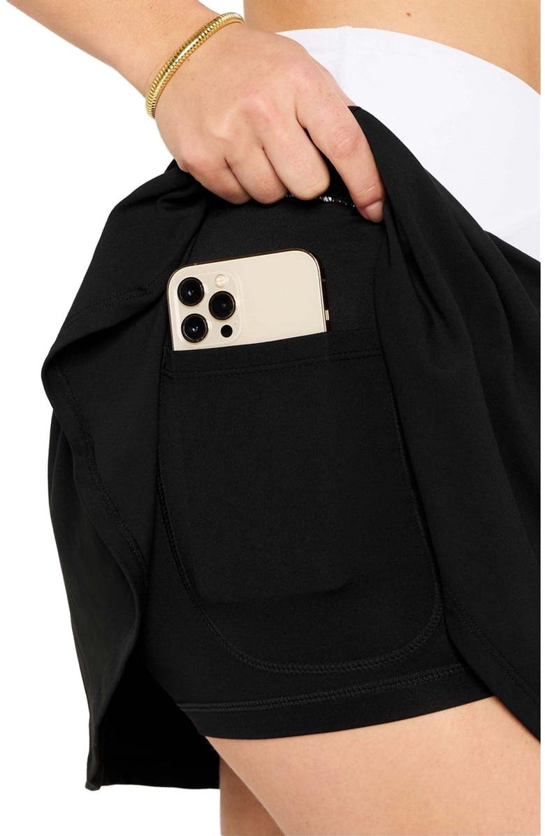 Fabletics Women's Crossover Flounce Skirt, Alternate, color, Black/Classic White