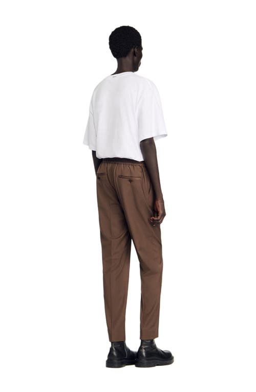 Sandro Elasticated Straight-leg Trousers In Brown