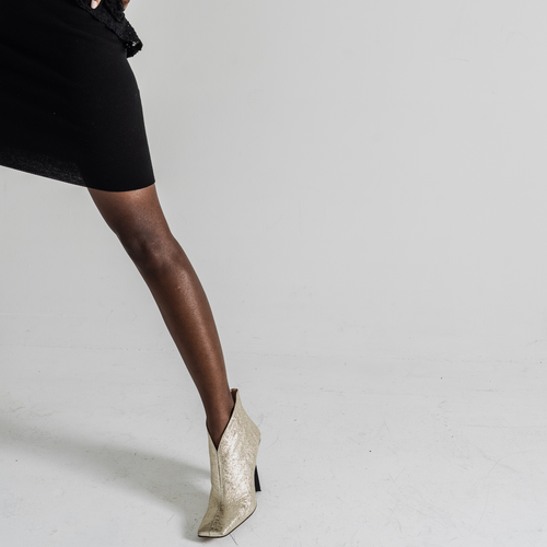 Tiannia Barnes Sancy Ankle Bootie In Gold