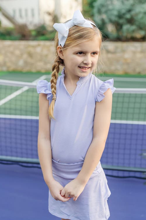 LILA AND HAYES LILA AND HAYES ELLIE GIRLS' SLEEVELESS RUFFLED TOP BY LH SPORT