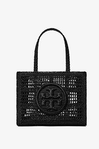 A woven black tote bag with a logo emblem. 