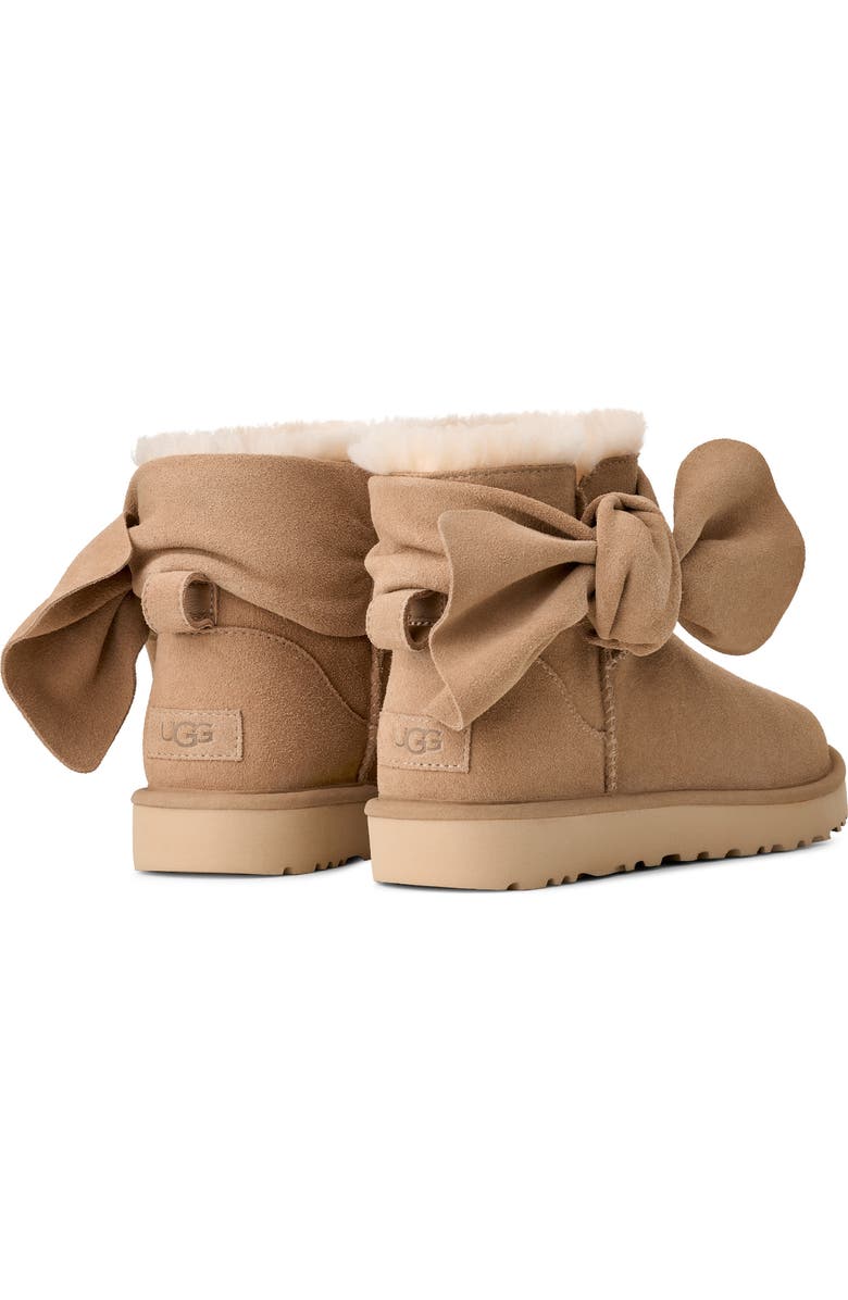 UGG<sup>®</sup> Classic Mini Bow Genuine Shearling Lined Boot, Alternate, color, Sand