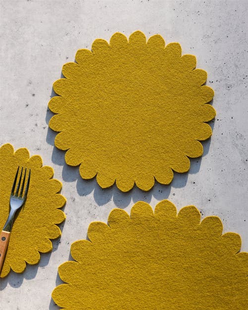 Graf & Lantz Graf Lantz Crest Merino Wool 10" Trivet In Yellow