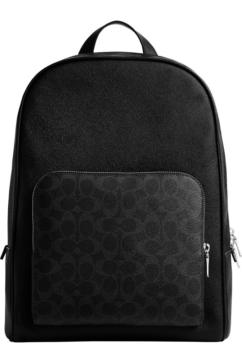 coach backpack black and white West In Signature Canvas Printed coated canvas and smooth calf leather Two separate main compartments with zip closures Inside zip cell phone and multifunction pockets Fabric lining Top handle with 2 1/2 drop Outside zip pocket Adjustable shoulder straps 12 1/2 (L) x 16 3/4 (H) x 6 (W) Coach x Tom Wesselmann Estate of Tom Wesselmann Hitch Backpack