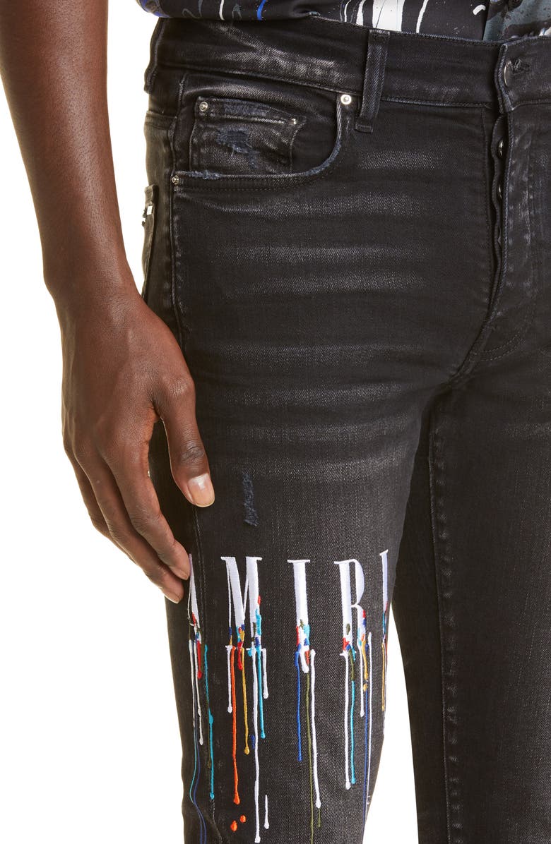 AMIRI Paint Drip Logo Ripped Skinny Jeans, Alternate, color, 