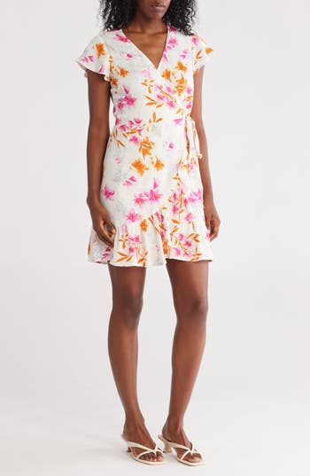 LOVESTITCH LOVESTITCH FLORAL FLUTTER SLEEVE WRAP DRESS