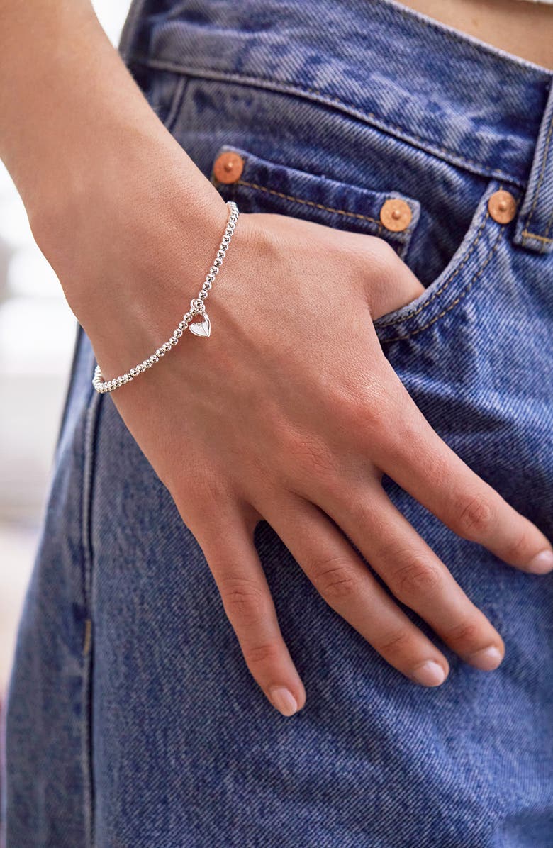 Estella Bartlett Sienna Folded Heart Beaded Stretch Bracelet, Alternate, color, Silver