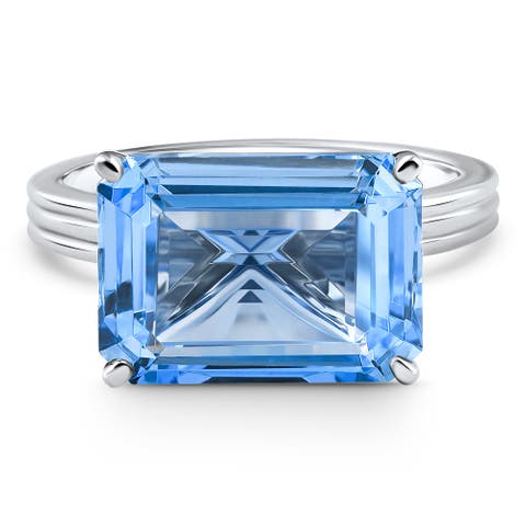 14x10mm Emerald Cut East to West Blue Topaz Solitaire Ring Gold