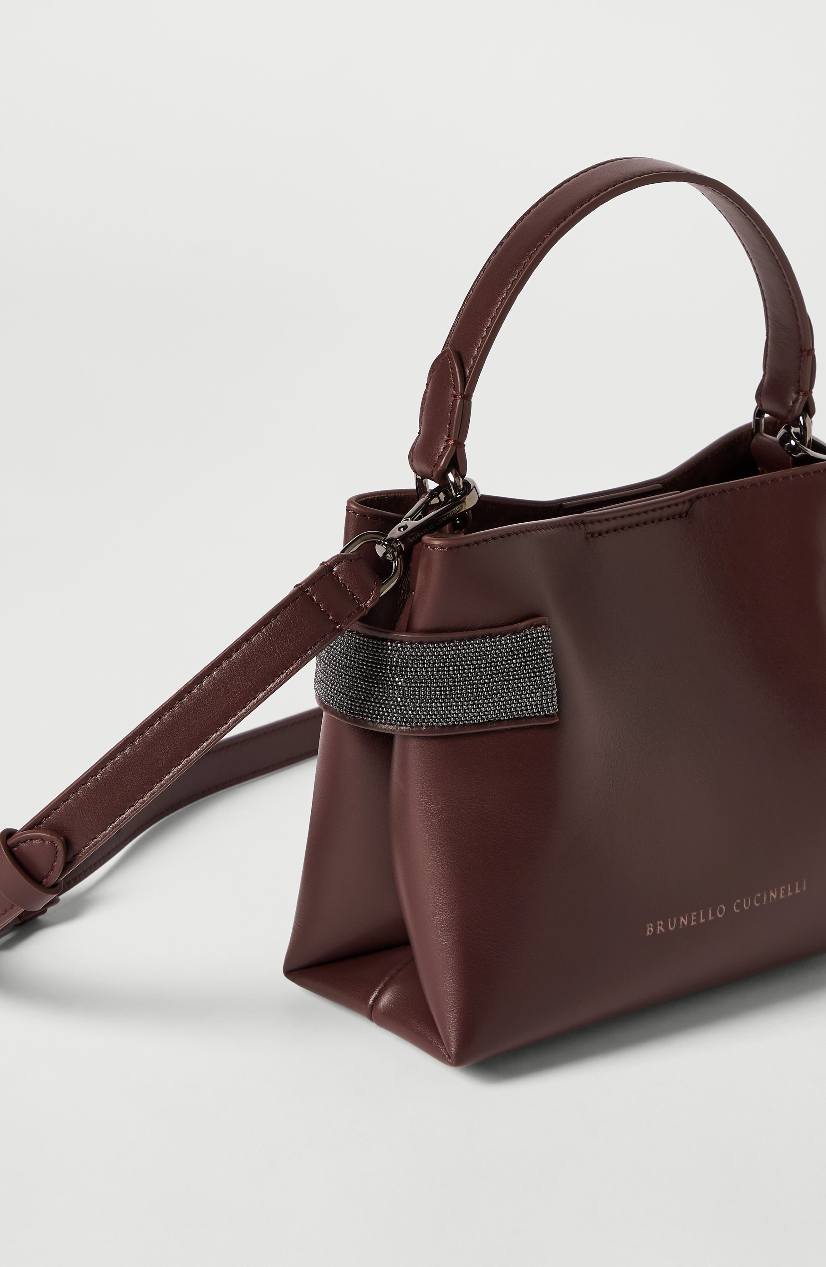 Essence small top-handle bag in calfskin with precious bands, Alternate, color, Burgundy