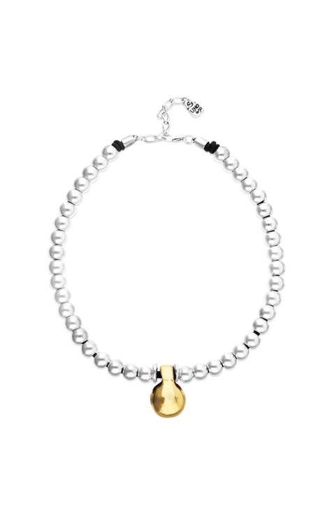 Necklace of medium spheres plated in sterling silver and large dial plated in 18k gold